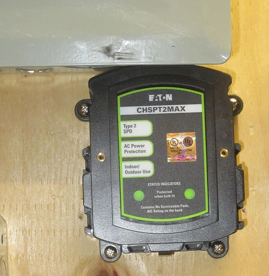 Surge protective equipment mounted near an electrical panel