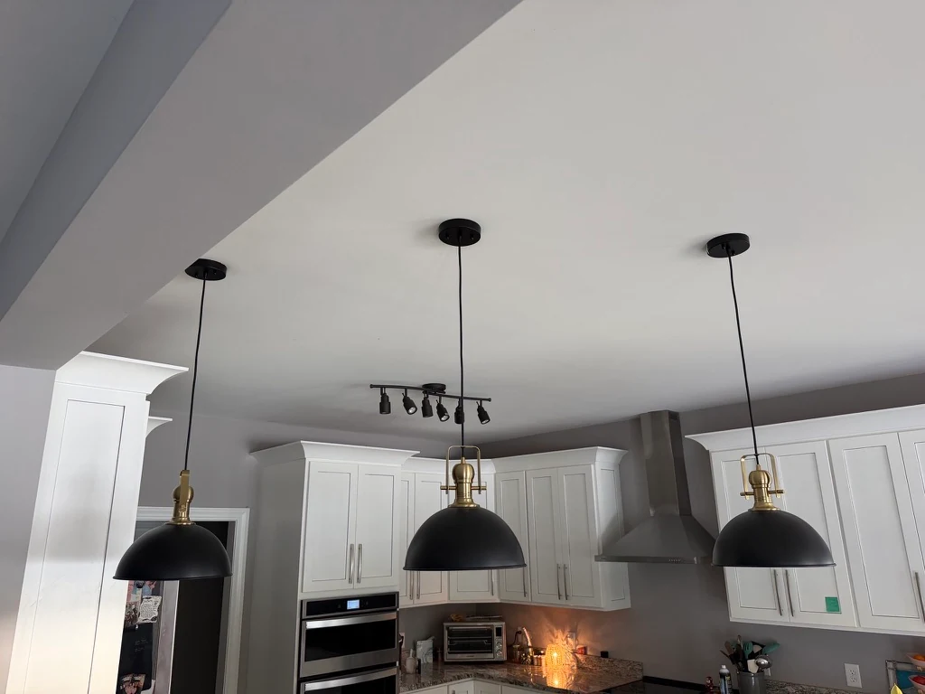 The same three kitchen pendant fixtures photographed with their lights off