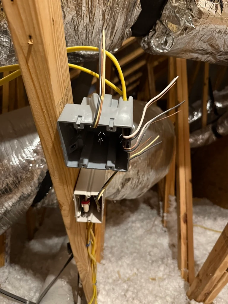 Electrical boxes and prepared conductors mounted to timber framing during rough-in work