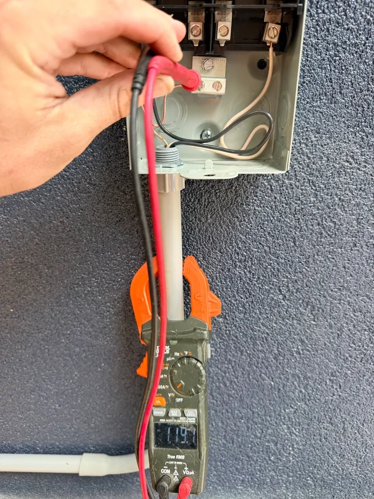 Test leads and meter used for an electrical assessment