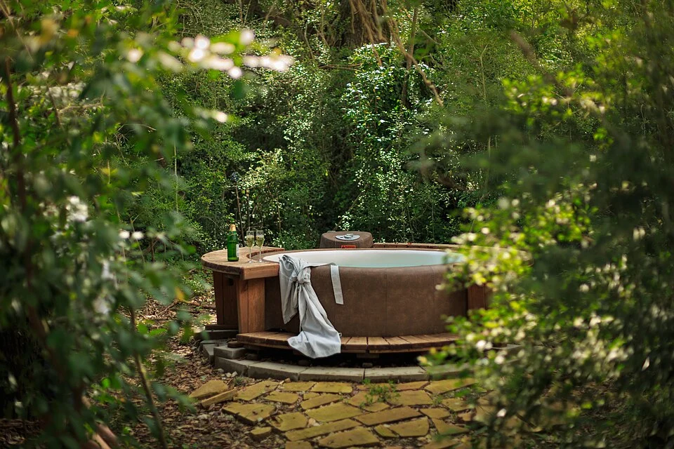 Outdoor hot tub at a Texas lodging property. Reference photograph; electrical equipment is not visible.