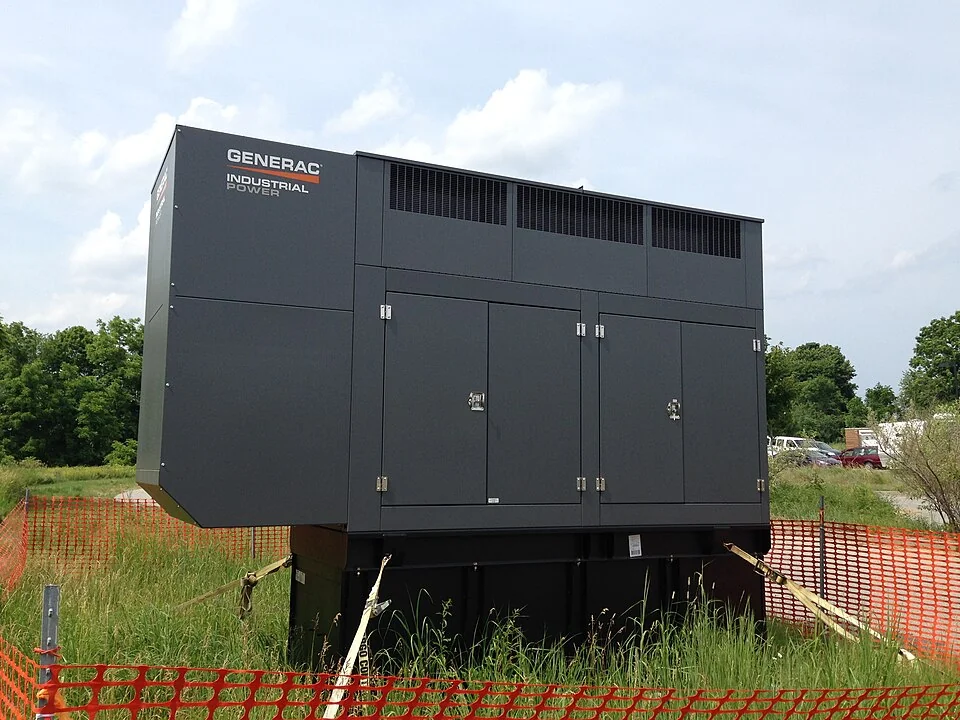 Enclosed outdoor Generac backup generator at a wildlife refuge visitor center.