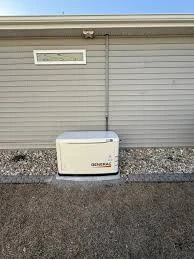 Compact outdoor Generac standby generator beside a home. Equipment example; sizing requires a load review.