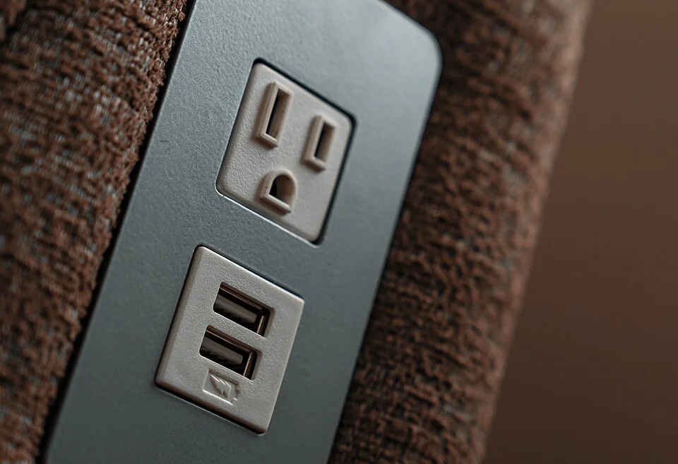 Photograph of power and USB-A charging outlets mounted in furniture