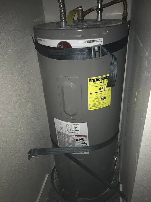 Electric storage-tank water heater with its protective access covers in place.