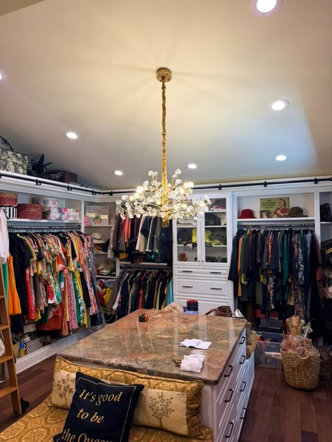 Another view of the room. A second room view of the installed chandelier.