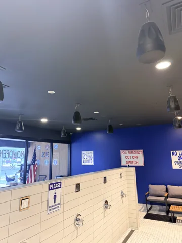 Commercial lighting. Pendant and ceiling lighting in a commercial interior.