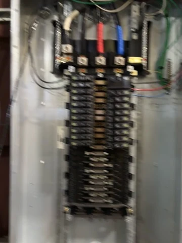Panel wiring, site view. An additional site photograph of panel work in progress.
