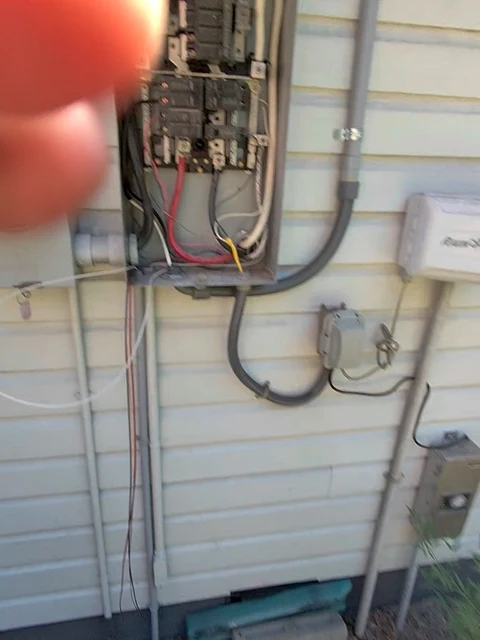 Electrical service, site view. An additional site view of exterior electrical service work in progress.