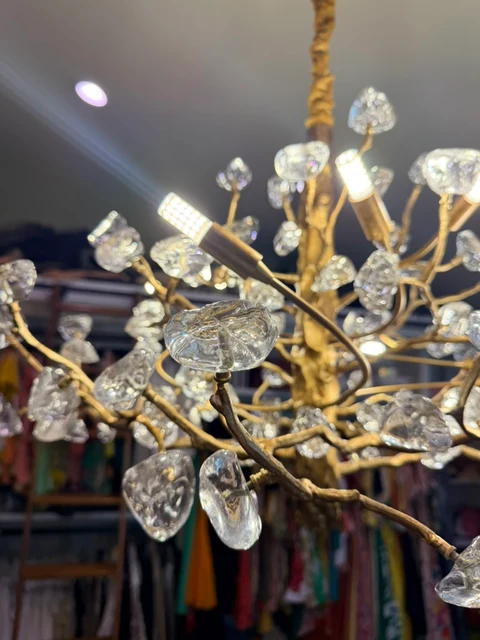Branches of light. An illuminated close-up of gold branches and crystal accents.