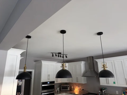 The kitchen, lights off. Kitchen pendant fixtures with the lights off, from a different viewpoint.